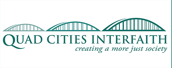 Small logo with a bridge and text that reads Quad Cities Interfaith creating a more just society